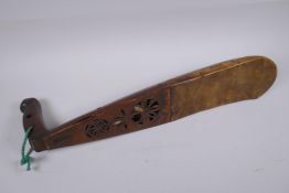 An African wood and hide stringed instrument, possibly a Ngoni, 52cm long