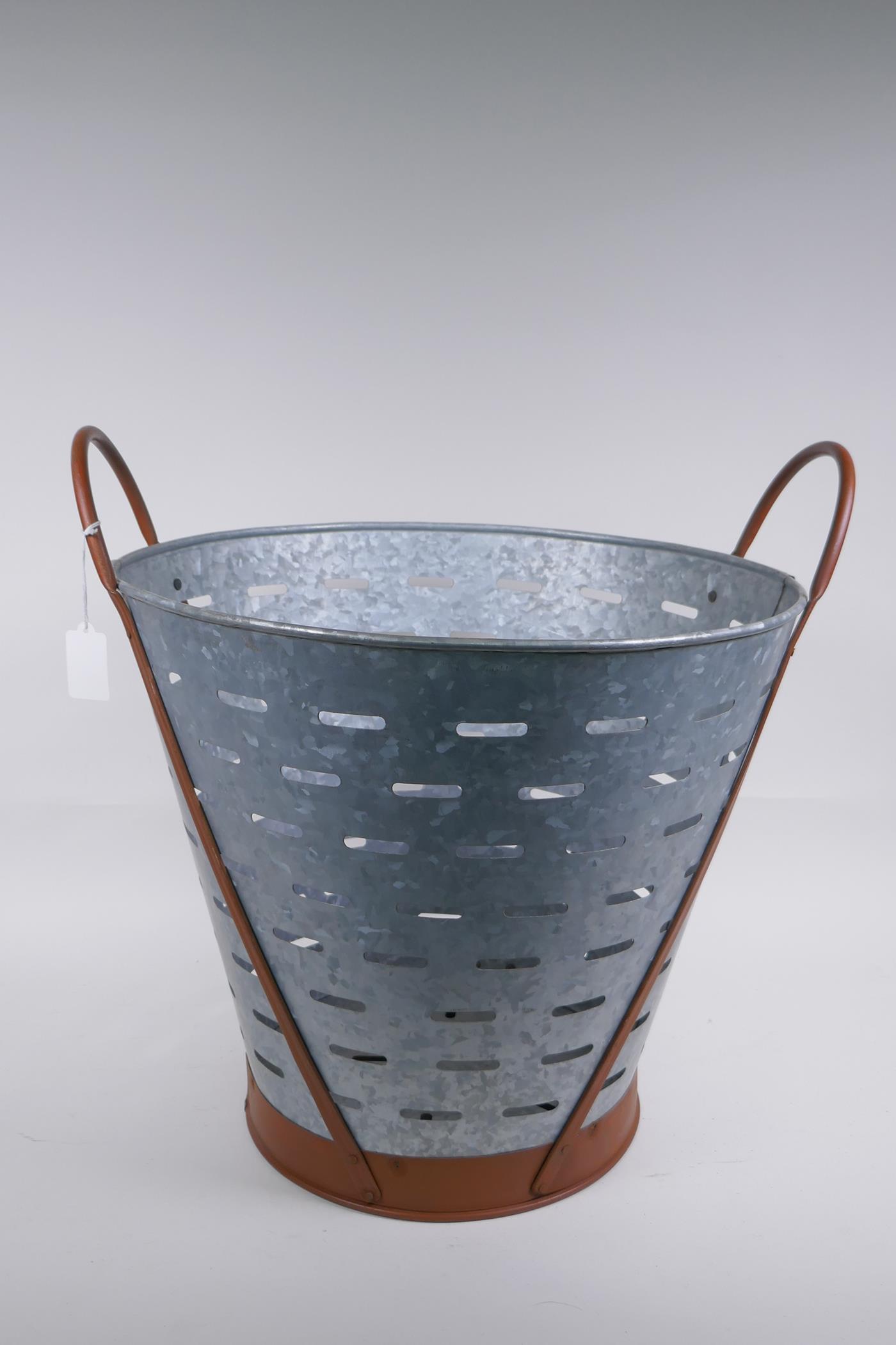 A galvanised metal and coper two handled olive bucket, 44cm high, 41cm diameter