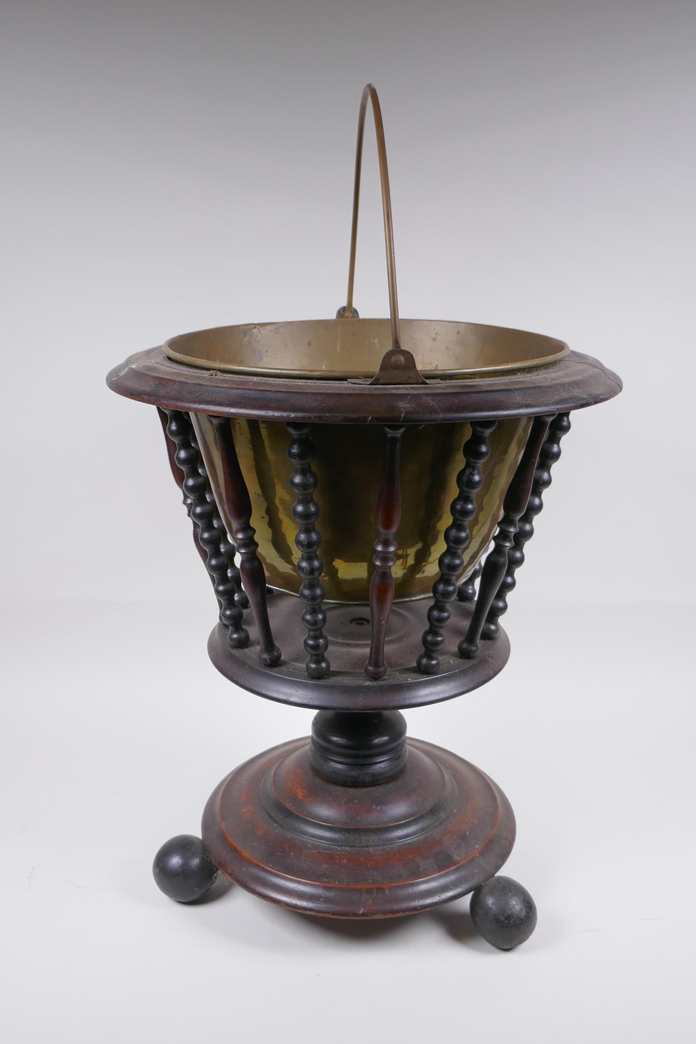 A Dutch wood and brass lined peat bucket with ring turned spindles, AF, 42cm high x 36cm diameter - Image 2 of 5