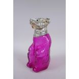 A silver plate and cranberry coloured glass bear decanter, 22cm high
