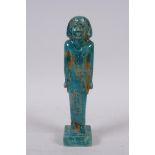 An Egyptian faience turquoise glaze shabti, 21cm high