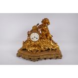 A C19th French ormolu mantel clock, the case decorated with a cherub playing twin pipes, the