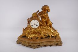 A C19th French ormolu mantel clock, the case decorated with a cherub playing twin pipes, the