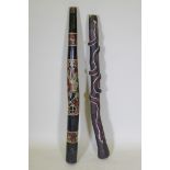 Two carved and painted didgeridoo, longest 126cm