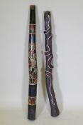 Two carved and painted didgeridoo, longest 126cm