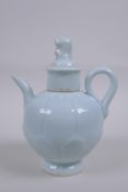 A Chinese pale blue glazed porcelain teapot of lotus flower form, 16cm high