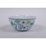 A Doucai porcelain tea bowl with lotus pond decoration, Chinese Chenghua 6 character mark to base,