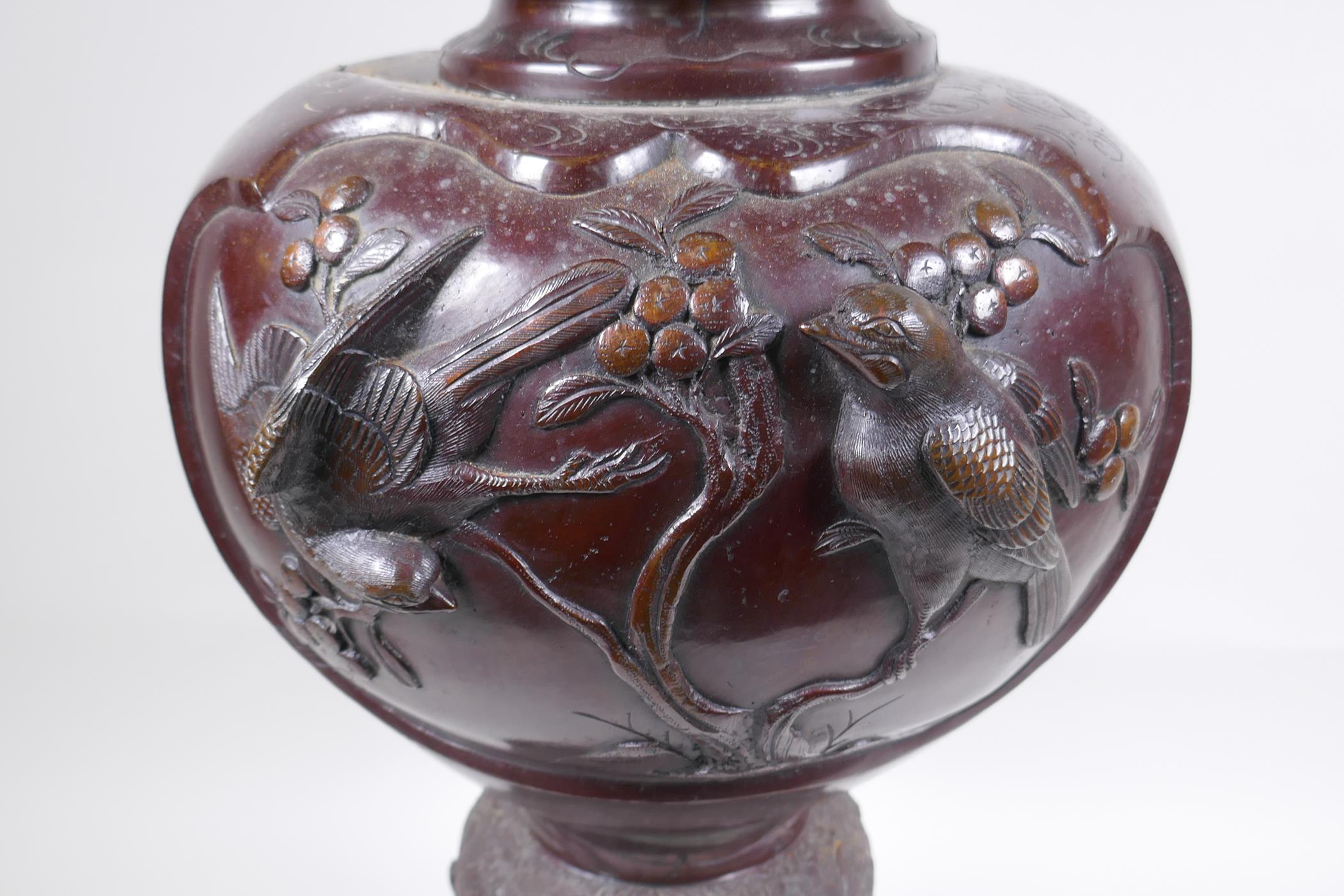 A Japanese Meiji period bronze urn with two handles and raised decorative panels depicting asiatic - Image 6 of 9