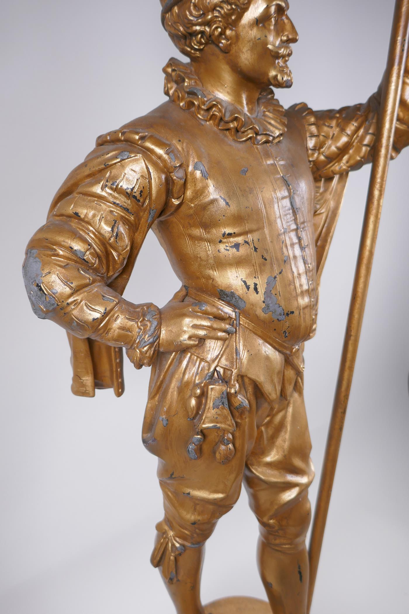 A gilt spelter figural lamp in the form of a Renaissance gentleman, 86cm high - Image 5 of 5