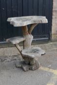 A root-wood two tier garden table, 85cm high