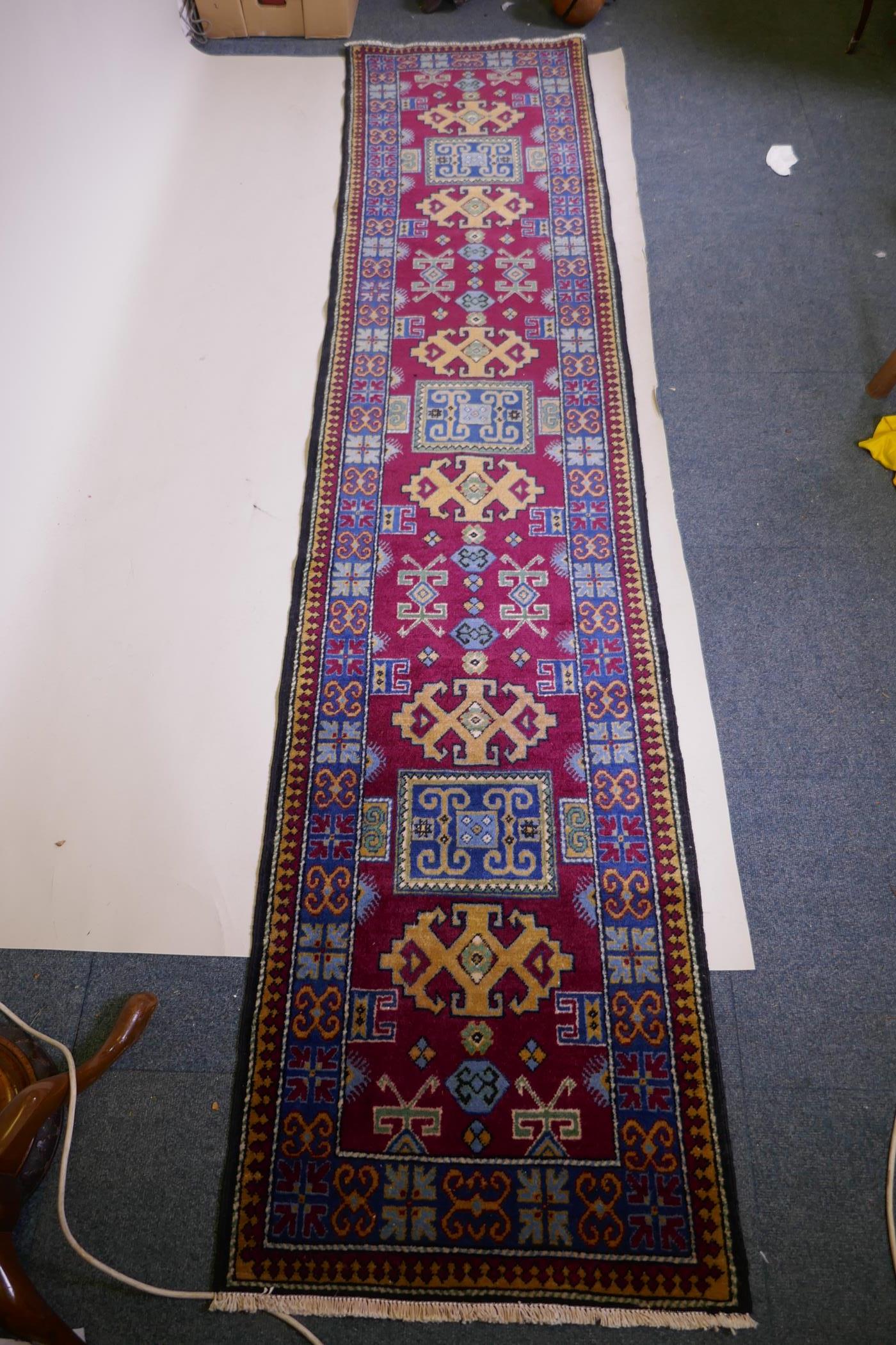 A claret wine ground wool caucasian runner with bespoke medallion design in unique colours, 322 x - Image 4 of 6