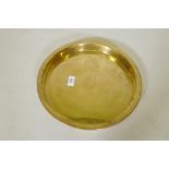 A brass tray engraved SS Nieuw-Amsterdam Holland-Amerika Lijn, 1st Class Only, 34cm diameter