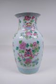 A Chinese famille rose porcelain vase with enamelled decoration depicting the eight Buddhist