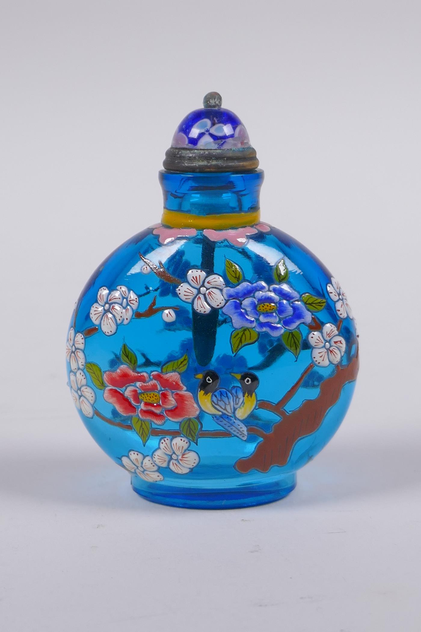 A Chinese blue glass snuff bottle with polychrome enamel decorated of birds in a prunus tree, 3