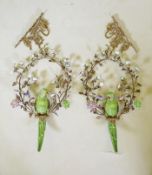 A pair of polychrome porcelain and gilt metal decorative hanging parrots with porcelain flowers,