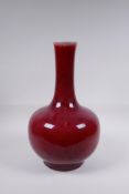 A Chinese flambe glazed porcelain bottle vase, 37cm high