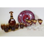 A Bohemian ruby glass decanter and six tumblers with etched and gilt decoration, a set of six wine