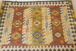 A woven wool kilim rug with geometric designs, 160 x 230cm