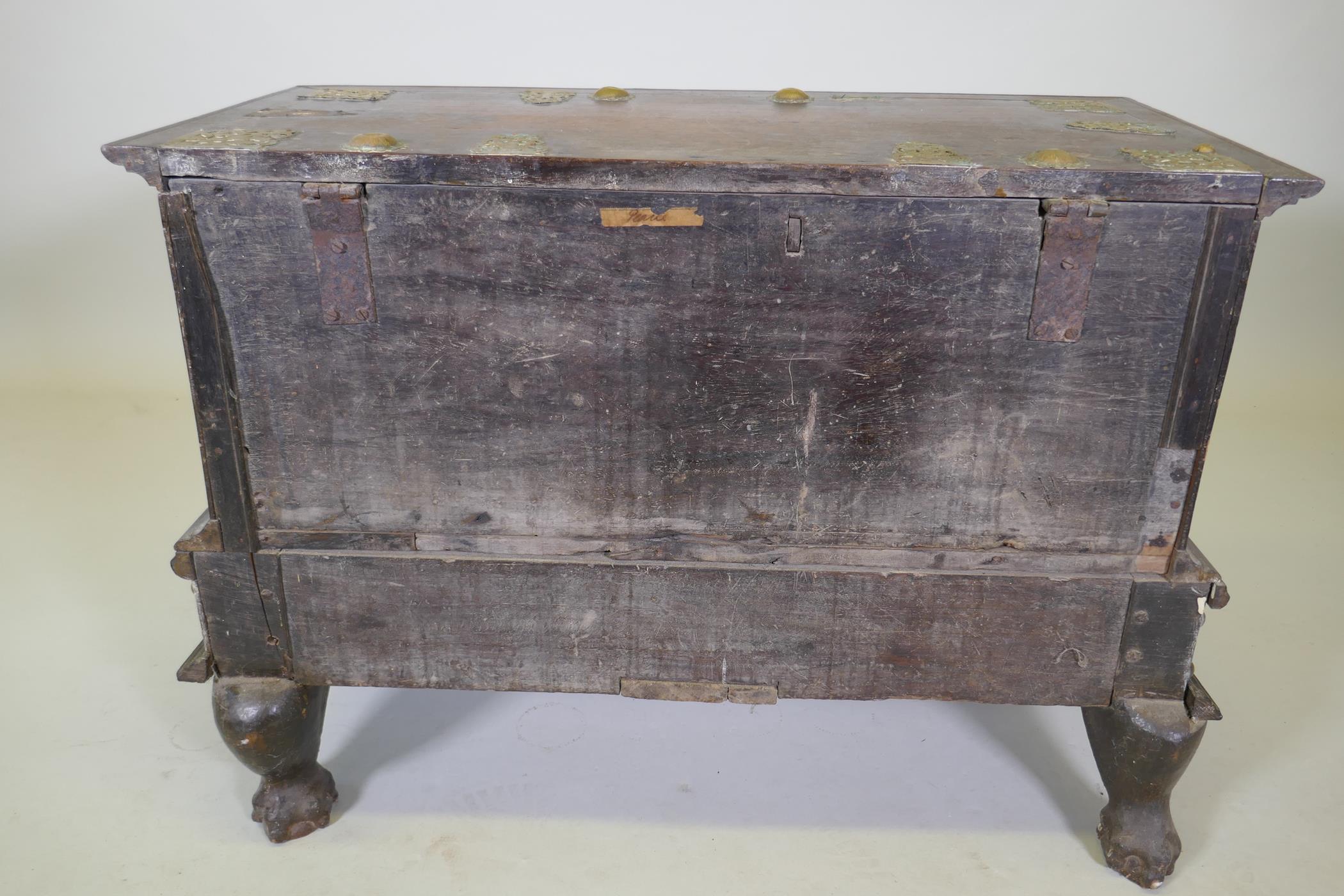 An C18th Dutch colonial teak chest with brass mounts, lift up top and two drawers, raised on claw - Image 8 of 8