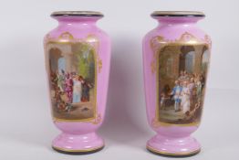 A pair of C19th continental pink ground vases with gilt highlights and decorated with tableaux