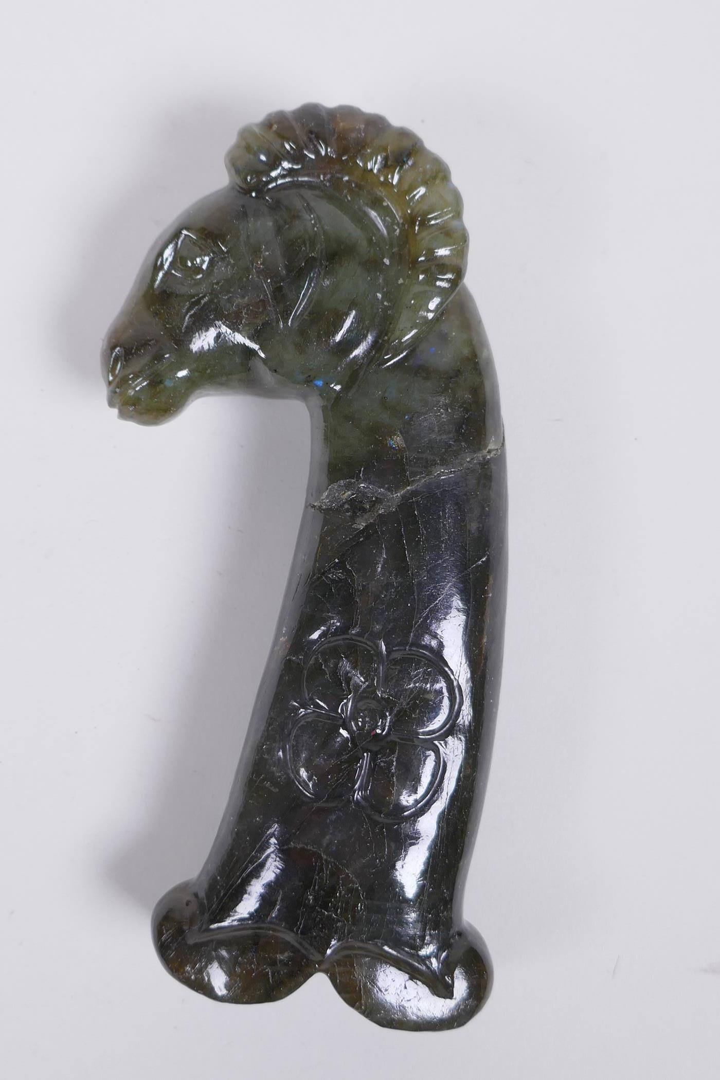 A Murghal style green hardstone dagger handle carved in the form of a ram's head, 14cm long, AF