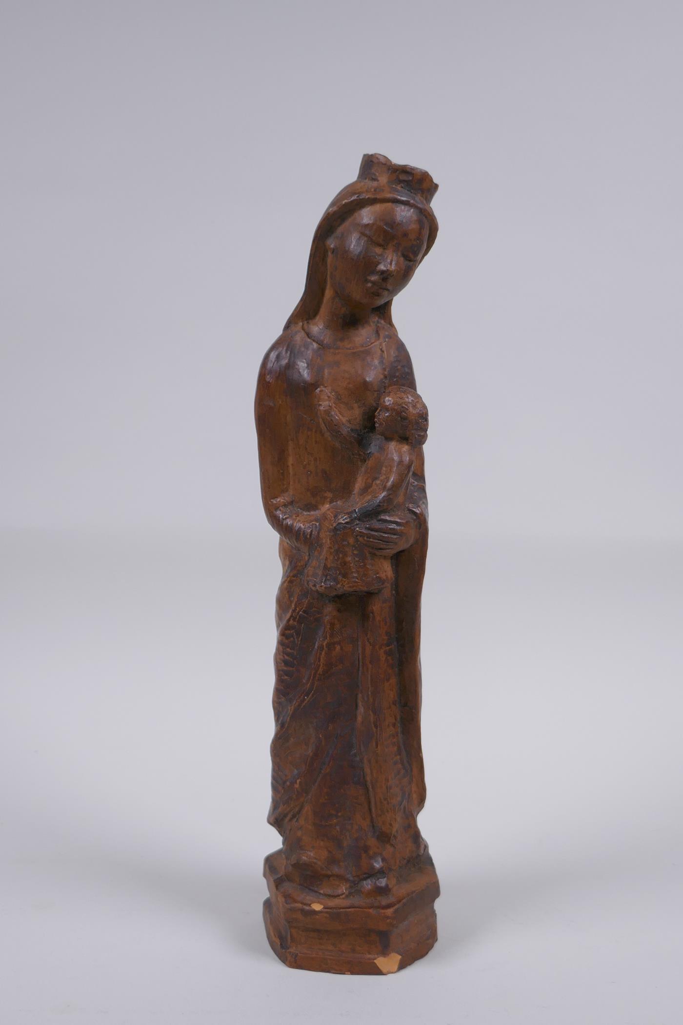 A terracotta figure of Mary and Jesus, 27cm high