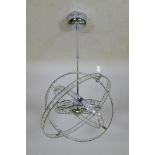 A contemporary chromed metal gimbal ceiling lamp, A/F, 56cm diameter, 82cm long