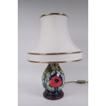 A Moorcroft pottery Poppy lamp, designed by Rachel Bishop, 44cm high including shade