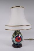 A Moorcroft pottery Poppy lamp, designed by Rachel Bishop, 44cm high including shade