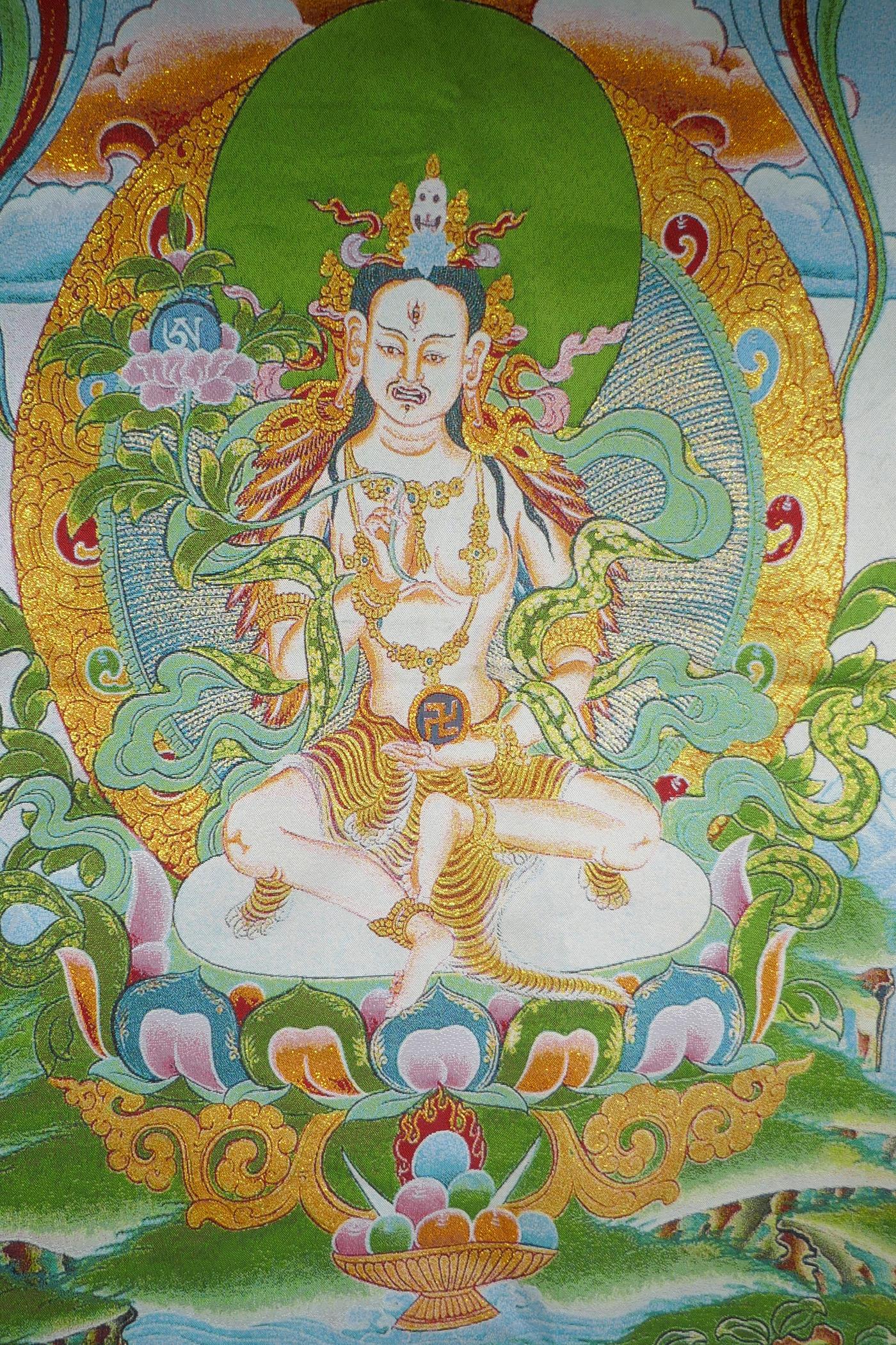 A Tibetan embroidered thangka with gilt thread highlights, 90 x 62cm