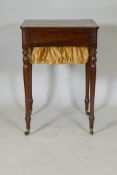 A Regency mahogany workbox, with candle slide and drawer with slope and pull out pen tray, and