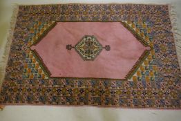 A pink ground Moroccan wool carpet, 125 x 193cm and a blue ground similar, 123 x 167cm