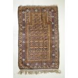 An antique Persian handwoven brown ground prayer mat with geometric directional design, worn, 96 x