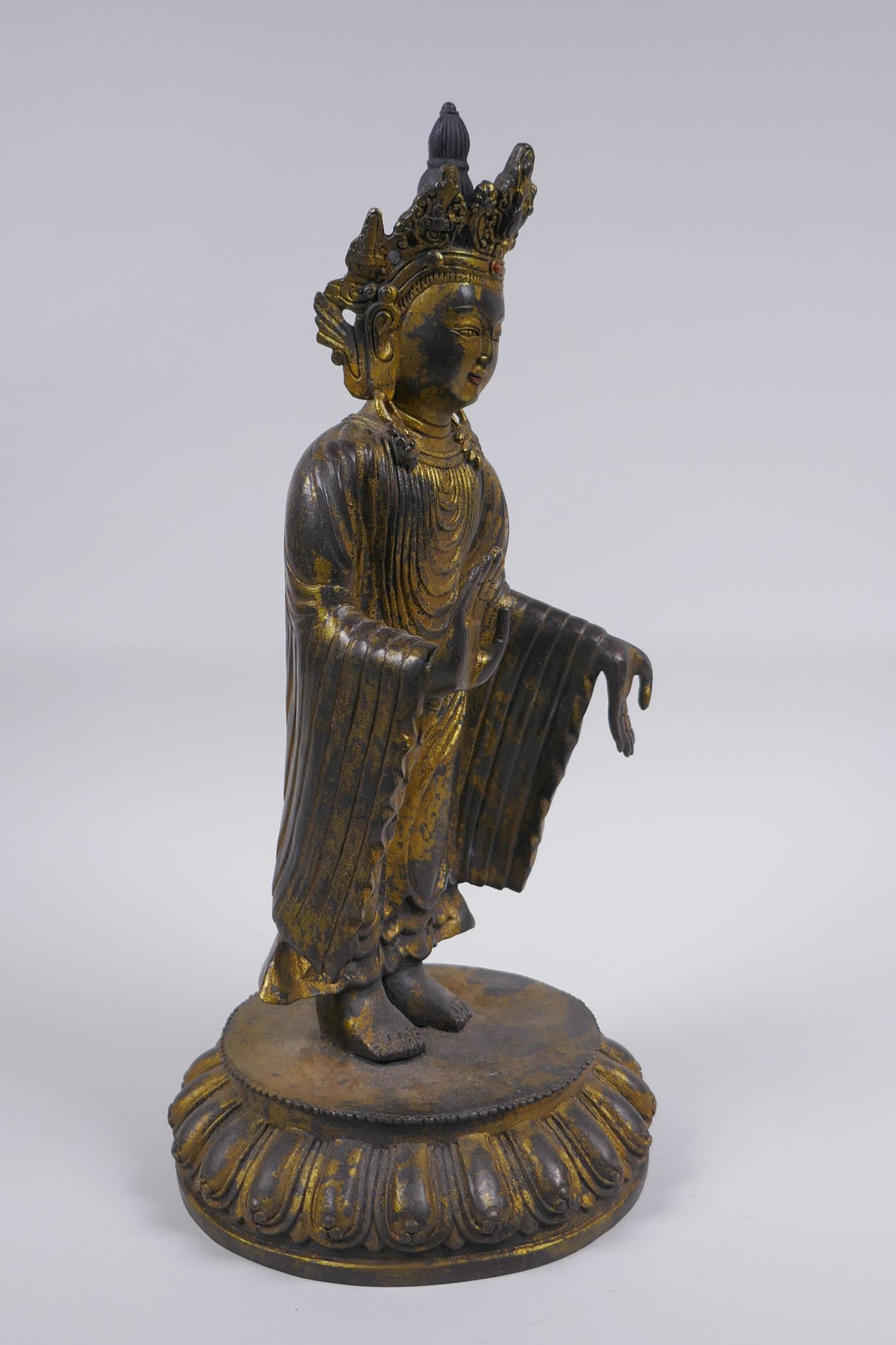 A Sino Tibetan gilt bronze figure of Buddha standing on a lotus flower, 32cm high - Image 3 of 6