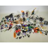 A large collection of Action Man toy dolls with various vehicles, dogs, clothing and accessories,