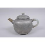 A Chinese painted YiXing teapot with a grey hardstone handle and spout, impressed seal mark to base,