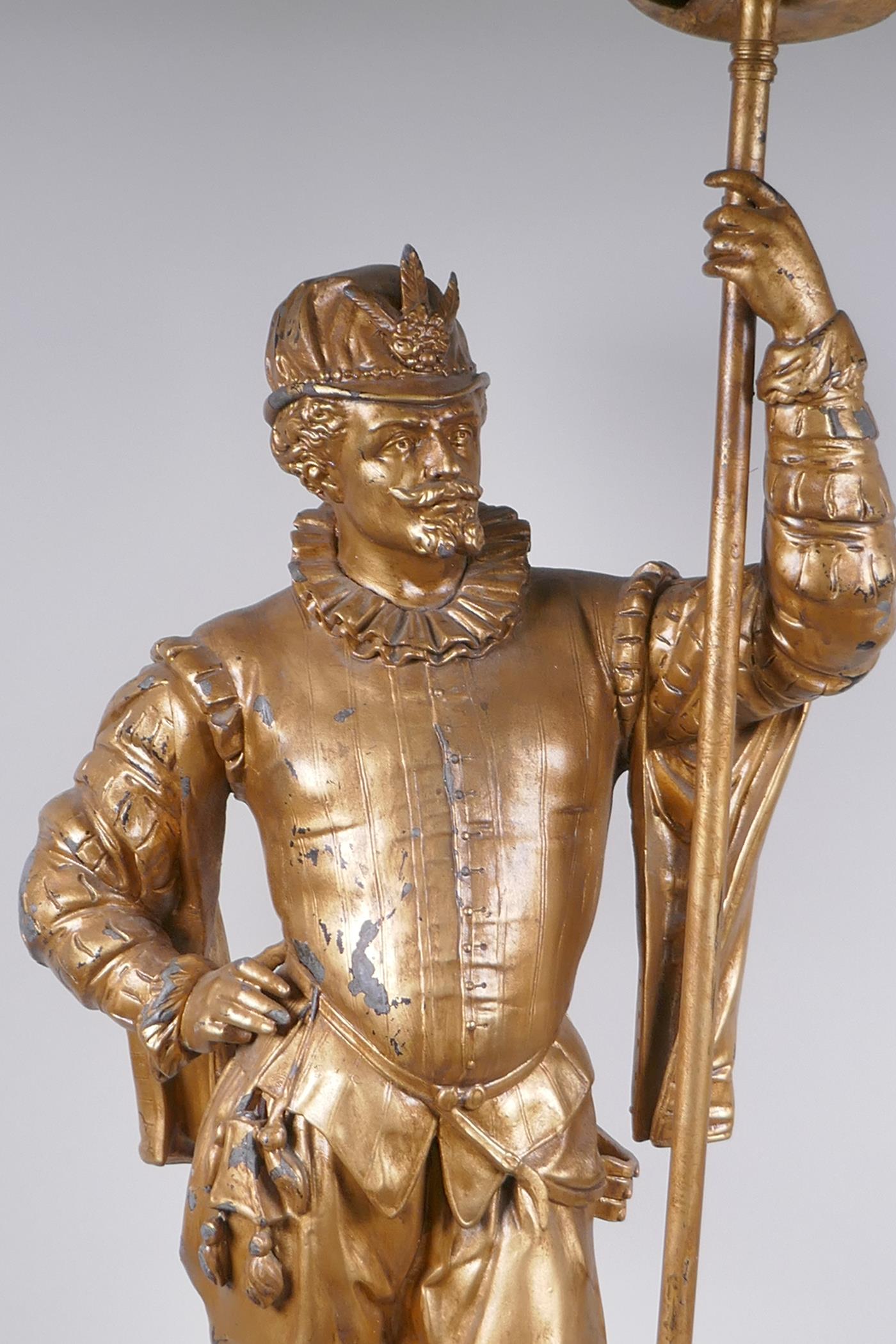 A gilt spelter figural lamp in the form of a Renaissance gentleman, 86cm high - Image 2 of 5