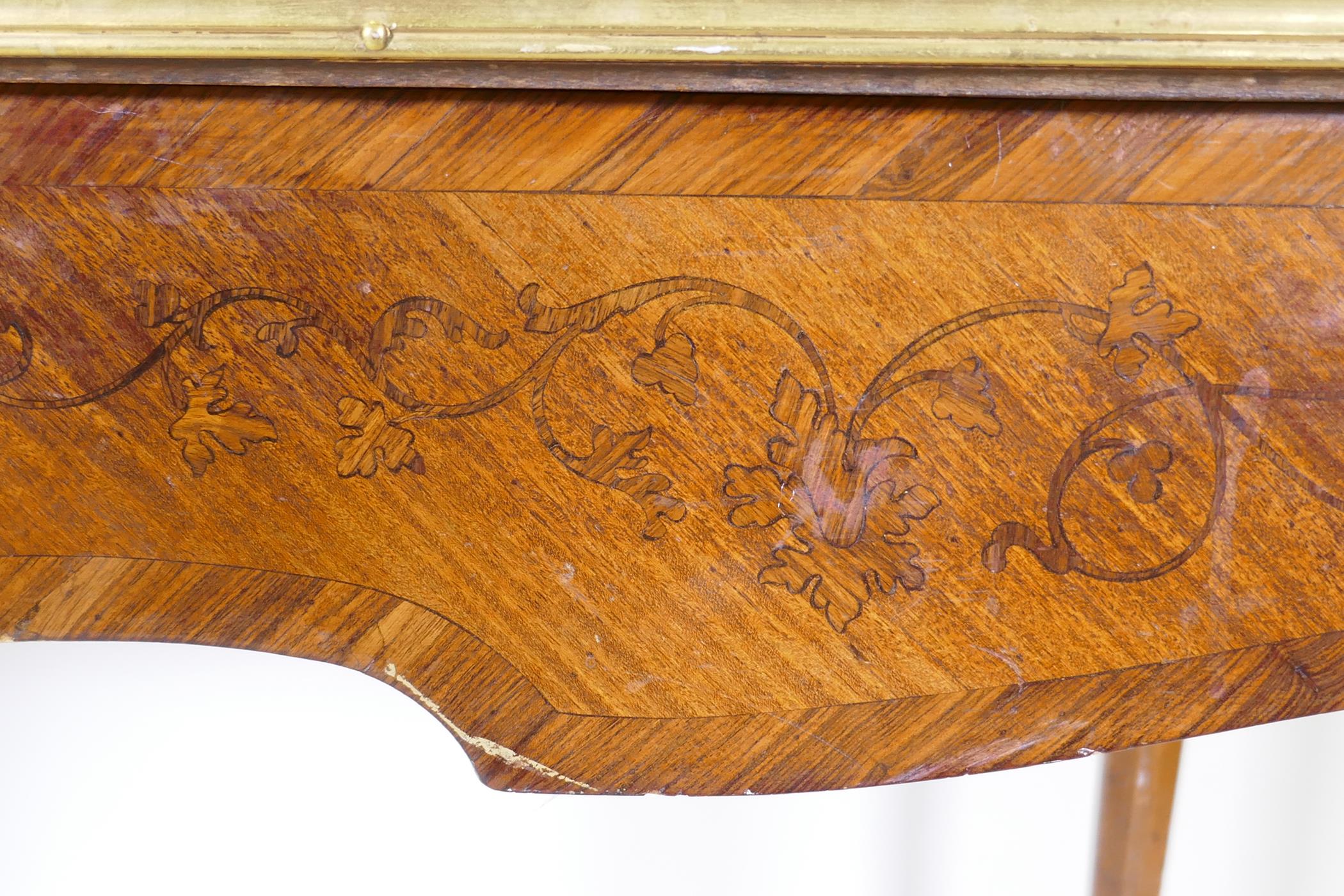 A French marquetry inlaid bureau plat, with shaped top, single drawer and ormolu mounts, bears label - Image 3 of 6