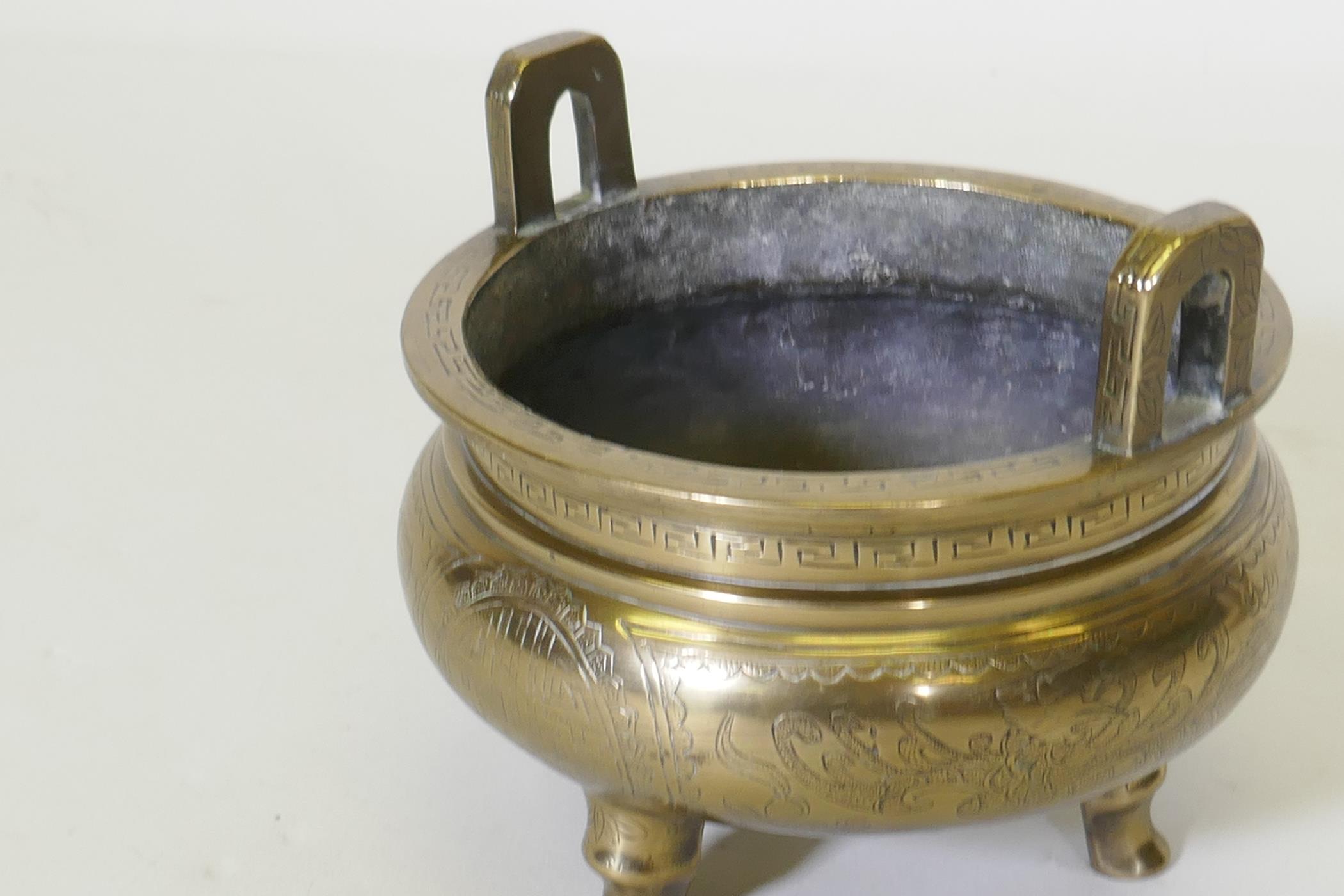 A Chinese polished brass censer with engraved dragon and phoenix decoration, seal mark to base, 16cm - Image 3 of 5