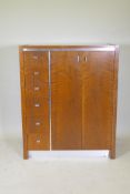 A mid century Founders walnut and metal gentleman's wardrobe, comprising a flight of six drawers and