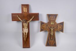 A pokerwork crucifix with brass Christ, and another with a painted composition Christ, largest