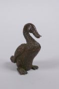 A Japanese style bronze okimono duck, mark to base, 5cm high