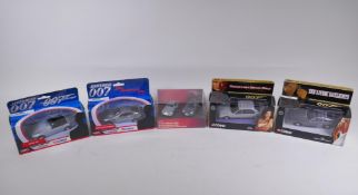 Four Corgi James Bond 007 diecast model cars, including the Aston Martin Volante (04801) from The