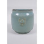 ÿChinese Ru ware style celadon glazed jar with twin mask decoration, 12cm high x 12cm diameter