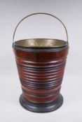 A Dutch coopered fruitwood and brass lined peat bucket, 34cm high, 28cm diameter