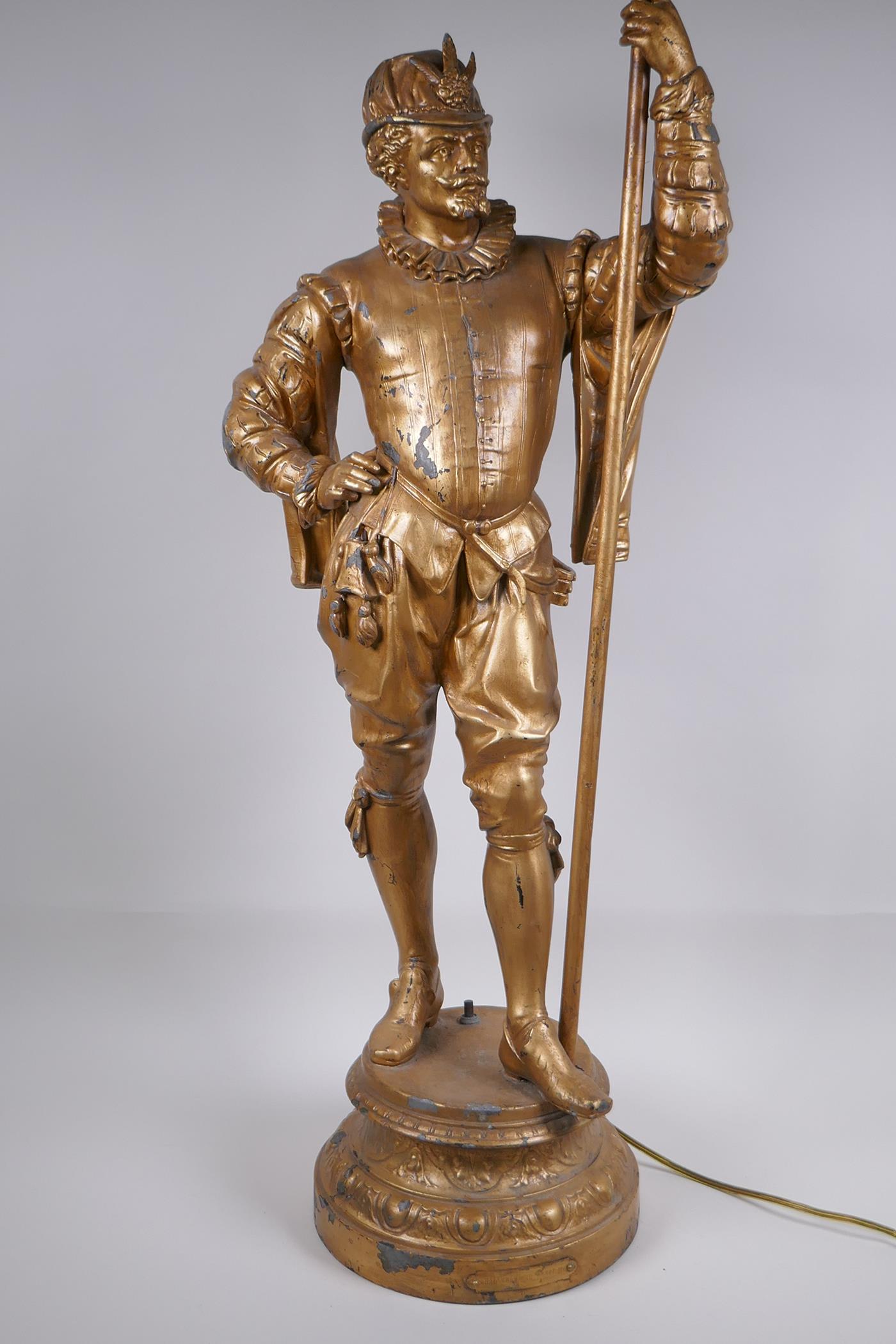 A gilt spelter figural lamp in the form of a Renaissance gentleman, 86cm high - Image 3 of 5