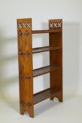 A Liberty style oak open book case, 72 x 20cm, 112cm high