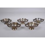 A set of five Chinese silvered metal cups/bowls with two dragon handles, 10 cm diameter