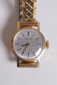A lady's 9ct gold cased Longines cocktail watch with a gold plated strap, the case numbered 13772,