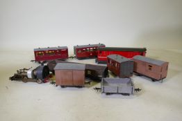 A scratch built train set, rolling stock and carriages with battery illumination and sound, carriage